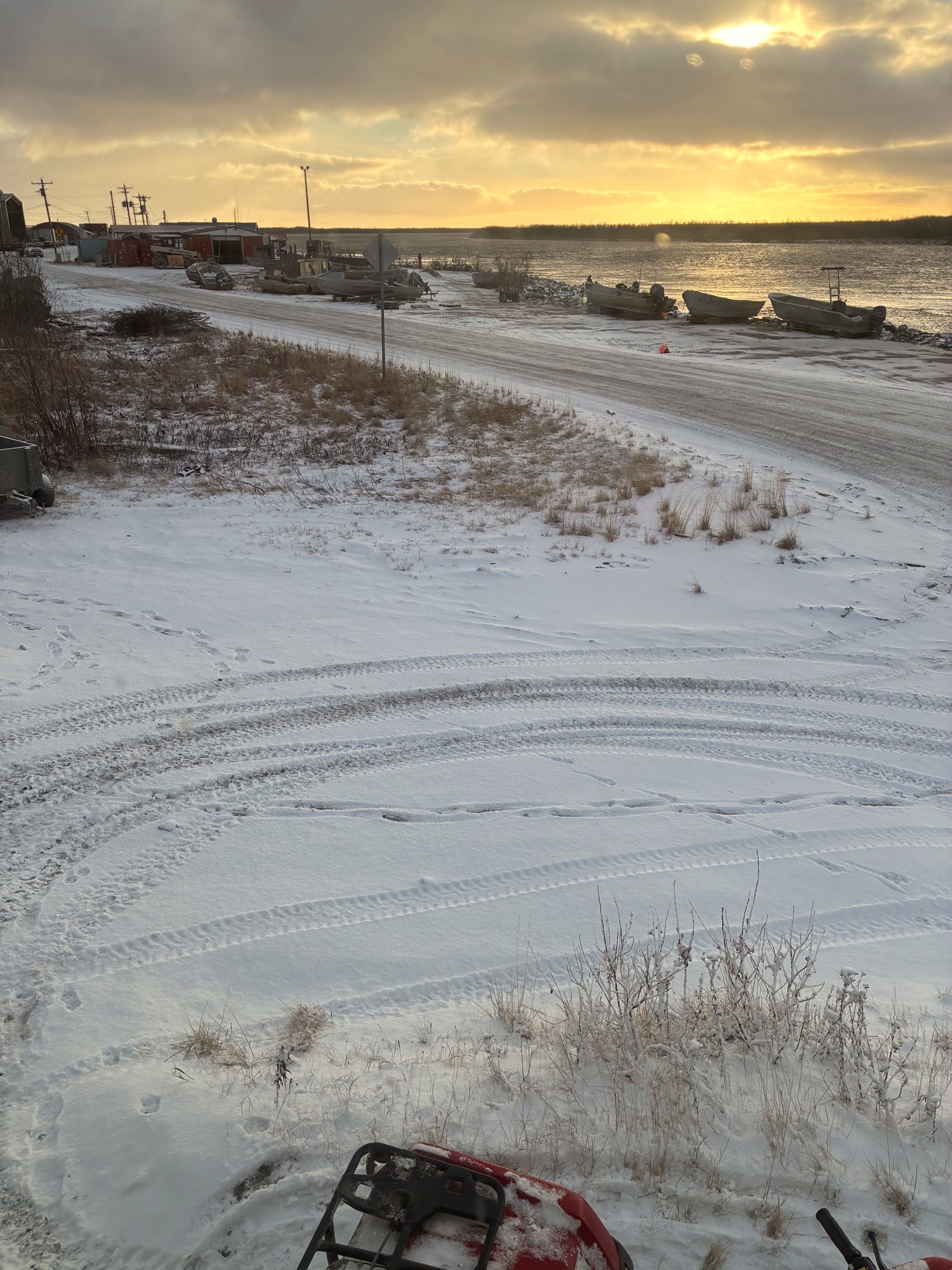 Sunrise on the Yukon · snowmobile tracks fresh